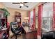 Cozy home office with custom built-ins, natural light, and comfortable workspace at 4770 Shiloh Springs Rd, Cumming, GA 30040