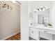 Bright bathroom with vanity, large mirror and storage space that flows into a walk-in closet at 2161 Peachtree Ne Rd # 405, Atlanta, GA 30309