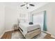 Bedroom with a ceiling fan, area rug, wood floors, and large window at 2161 Peachtree Ne Rd # 405, Atlanta, GA 30309