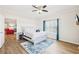 Bedroom with hardwood floors, ceiling fan, and view into living room at 2161 Peachtree Ne Rd # 405, Atlanta, GA 30309