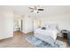 Bright bedroom with walk-in bathroom and hardwood floors and ceiling fan at 2161 Peachtree Ne Rd # 405, Atlanta, GA 30309