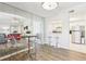 Well lit dining room area with stainless steel appliances and modern white cabinetry at 2161 Peachtree Ne Rd # 405, Atlanta, GA 30309