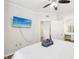 Bright main bedroom with a beach themed flat screen TV and neutral decor at 2161 Peachtree Ne Rd # 405, Atlanta, GA 30309