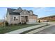 Inviting home with stone accents, manicured lawn, and a two car garage at 231 Laurel Vista Dr, Canton, GA 30114