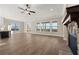 Spacious living room boasts a stone fireplace, ceiling fan, and large windows with scenic views at 231 Laurel Vista Dr, Canton, GA 30114