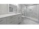 Bathroom featuring a vanity with marble countertop and a glass-enclosed shower with marble tile at 300 Johnson Ferry Ne Rd # B113, Atlanta, GA 30328