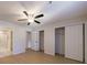Bedroom featuring a ceiling fan, view of a bathroom and a closet at 300 Johnson Ferry Ne Rd # B113, Atlanta, GA 30328