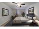 Bright bedroom with queen bed, ceiling fan, and decorative art at 300 Johnson Ferry Ne Rd # B113, Atlanta, GA 30328