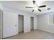 Bedroom featuring ceiling fan, a window, and closets at 300 Johnson Ferry Ne Rd # B113, Atlanta, GA 30328