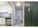 Condo entryway featuring stainless appliances, granite countertops, and wood floors at 300 Johnson Ferry Ne Rd # B113, Atlanta, GA 30328