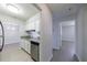 Bright kitchen with white cabinets, stainless steel appliances, and wood flooring at 300 Johnson Ferry Ne Rd # B113, Atlanta, GA 30328