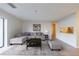 Bright living room features neutral decor, gray wood floors, and a pass through to the kitchen at 300 Johnson Ferry Ne Rd # B113, Atlanta, GA 30328
