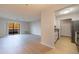 Open living space with stainless appliances, wood floors, and balcony access at 300 Johnson Ferry Ne Rd # B113, Atlanta, GA 30328