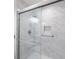 The glass shower features marble tile and a built-in niche at 300 Johnson Ferry Ne Rd # B113, Atlanta, GA 30328