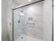 The glass shower features marble tile and a built-in niche at 300 Johnson Ferry Ne Rd # B113, Atlanta, GA 30328