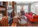 Cozy living room with fireplace, built-in bookshelves, and an abundance of natural light at 708 Collier Commons Nw Cir, Atlanta, GA 30318