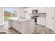 A kitchen with stainless steel appliances and a center island at 8516 Polston Place Dr, Douglasville, GA 30134
