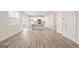 A modern kitchen with stainless steel appliances, a center island, and wood floors at 8516 Polston Place Dr, Douglasville, GA 30134