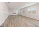 Spacious living room with hardwood floors, modern fireplace, and large windows that bring in natural light at 8516 Polston Place Dr, Douglasville, GA 30134