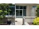 Private entryway with glass doors and concrete planters for added privacy at 943 Peachtree Ne St # 704, Atlanta, GA 30309