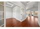 Light-filled entryway with rich hardwood floors and convenient coat closet at 1602 Renaissance Ne Dr, Conyers, GA 30012