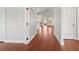 Spacious entryway with gleaming hardwood floors and glass-paneled door at 1602 Renaissance Ne Dr, Conyers, GA 30012