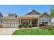 Charming single Gathering home with manicured lawn and attached two car garage at 1602 Renaissance Ne Dr, Conyers, GA 30012