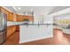 Kitchen with stainless appliances, stylish backsplash, island with bar seating, and window nook at 1602 Renaissance Ne Dr, Conyers, GA 30012