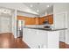 Modern kitchen with granite countertops, hardwood floors, and stainless steel appliances at 1602 Renaissance Ne Dr, Conyers, GA 30012