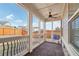 Enclosed patio with brick floor, ceiling fan, and views of the fenced backyard at 1602 Renaissance Ne Dr, Conyers, GA 30012