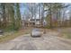 Spacious backyard features a large concrete pad, perfect for parking, play, and entertaining at 2520 Waterford Park Dr, Lawrenceville, GA 30044
