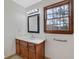 Bathroom featuring a modern vanity, stylish lighting, and a framed mirror at 2520 Waterford Park Dr, Lawrenceville, GA 30044