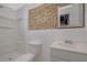 Stylish bathroom showcases a stone accent wall, a modern vanity, and a walk-in shower at 2520 Waterford Park Dr, Lawrenceville, GA 30044