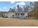 Charming home with front porch, surrounded by mature trees and landscaping on a spacious lot at 2520 Waterford Park Dr, Lawrenceville, GA 30044