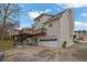 Rear exterior of the house features a wooden deck and convenient garage access at 2520 Waterford Park Dr, Lawrenceville, GA 30044