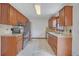 Galley kitchen featuring stainless steel appliances, granite countertops and tile backsplash at 2520 Waterford Park Dr, Lawrenceville, GA 30044