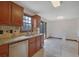 Kitchen featuring stainless appliances, a granite countertop, and a serving window to the dining area at 2520 Waterford Park Dr, Lawrenceville, GA 30044