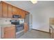 Kitchen with stainless steel appliances, granite countertops and wood cabinets at 2520 Waterford Park Dr, Lawrenceville, GA 30044