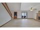 Spacious living room features light wood floors, a brick fireplace, and a staircase to the upper level at 2520 Waterford Park Dr, Lawrenceville, GA 30044