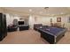 Finished basement with a pool table, media area, and plenty of room for recreation at 1023 Spruce Creek Ln, Lawrenceville, GA 30045