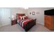 Bedroom with a simple door, TV, and dresser at 1023 Spruce Creek Ln, Lawrenceville, GA 30045
