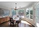 Cozy dining area bathed in natural light from large windows with views of the backyard at 1023 Spruce Creek Ln, Lawrenceville, GA 30045