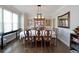 Elegant dining room featuring hardwood floors, decorative lighting, and ample space for entertaining at 1023 Spruce Creek Ln, Lawrenceville, GA 30045