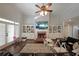 Inviting living room boasts a brick fireplace, built-in bookshelves, and ample natural light at 1023 Spruce Creek Ln, Lawrenceville, GA 30045