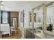 Bedroom with exposed brick, hardwood floors, ceiling fan, and vanity at 24 Daniel St # 6, Atlanta, GA 30312