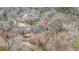 Scenic aerial view of a charming home nestled amidst a wooded landscape near a serene pond at 4144 D Youville Trce, Atlanta, GA 30341