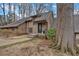 Charming home showcasing inviting front porch, well-maintained lawn, and mature trees at 4144 D Youville Trce, Atlanta, GA 30341