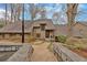 Charming home with detailed stone retaining wall, walkways and mature trees at 4144 D Youville Trce, Atlanta, GA 30341