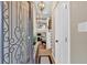 Inviting foyer with an iron-decorated front door, hardwood floors, and an open view to the staircase at 4144 D Youville Trce, Atlanta, GA 30341
