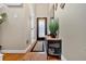 Well-lit foyer features beautiful hardwood floors, neutral wall paint, and stylish furniture accents at 4144 D Youville Trce, Atlanta, GA 30341